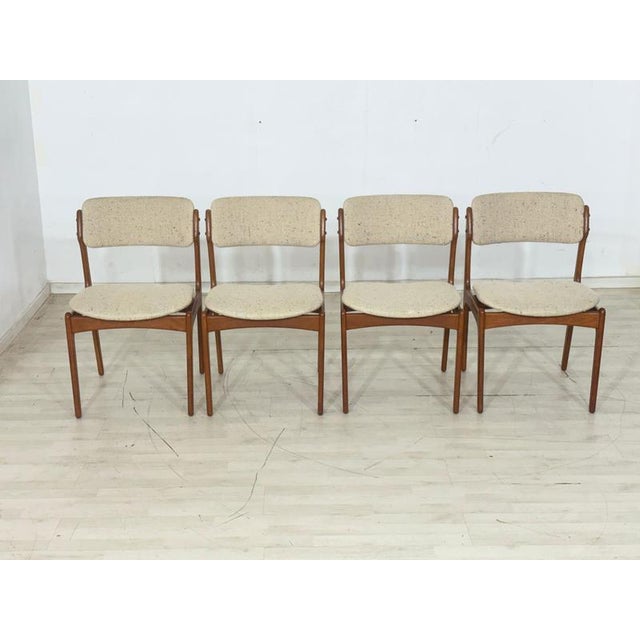 Set of four elegant mid-century dining chairs, designed by renowned danish designer erik buch and manufactured by o.d....