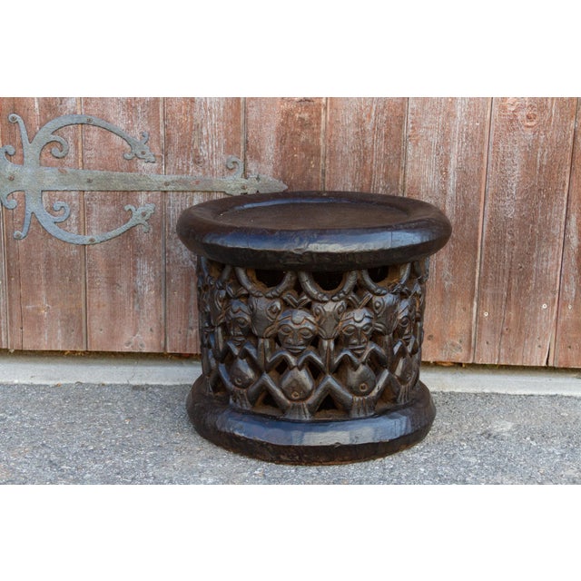 This round African tribal table is carved out of single hallowed out tree trunk, on the top the original wood grain is...