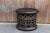 This round African tribal table is carved out of single hallowed out tree trunk, on the top the original wood grain is...