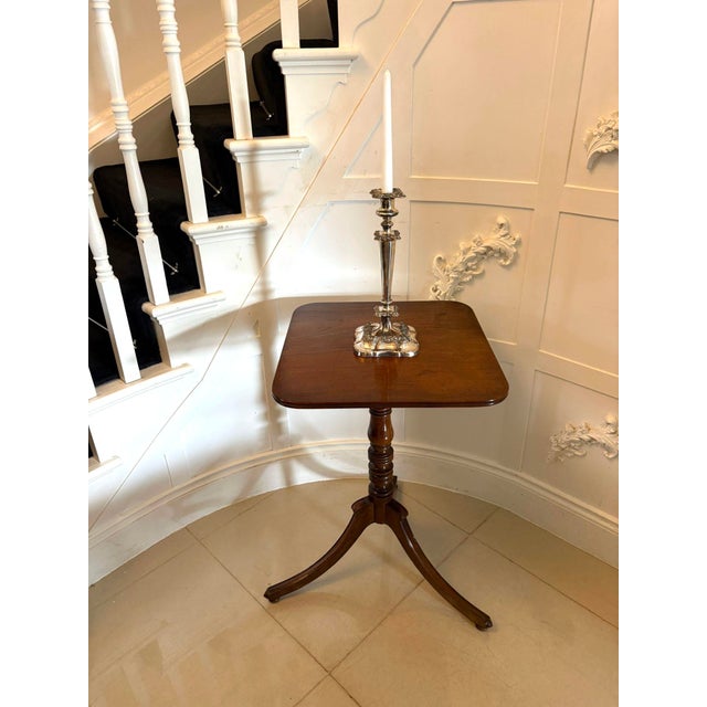 A fine antique Georgian mahogany tilt top tripod table of elegant proportions, raised on a turned central column with...
