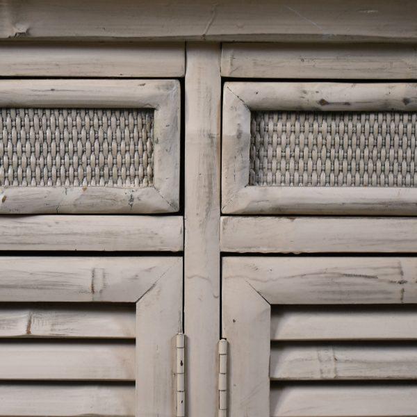 A characterful vintage dresser in distressed split bamboo, where timeworn texture meets tropical charm. The weathered...
