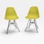 This pair of authentic Eames Molded Plastic Side Chairs (DSR) features lime green molded plastic seats with the classic...