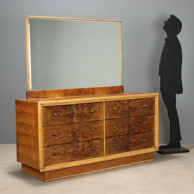 1940s dresser with mirror, featuring a simple and functional design typical of the period. The structure is made of veneer...