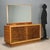 1940s dresser with mirror, featuring a simple and functional design typical of the period. The structure is made of veneer...