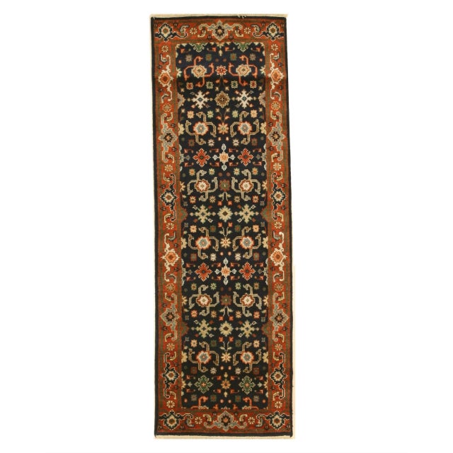 Violet Exquisite Navy Hand Knotted Wool Rug, Country of Origin: India. This magnificent piece showcases the enduring skill...