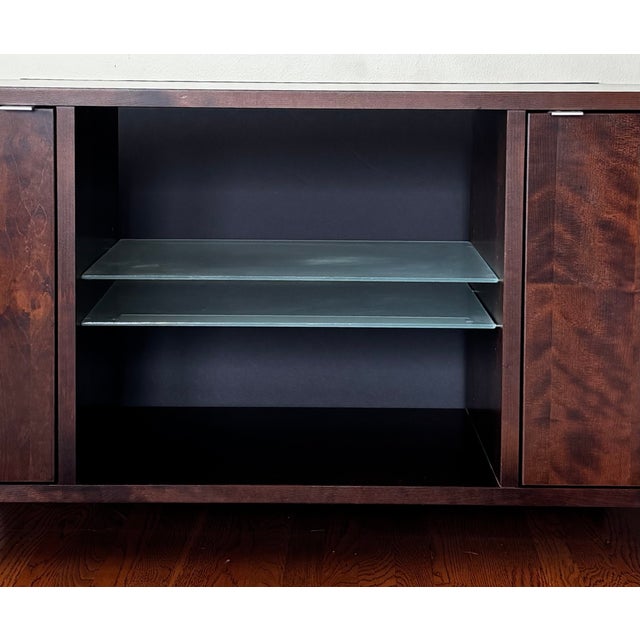 Beautiful mid-century modern media console in a rich espresso finish, featuring distinctive retro-style legs that add...