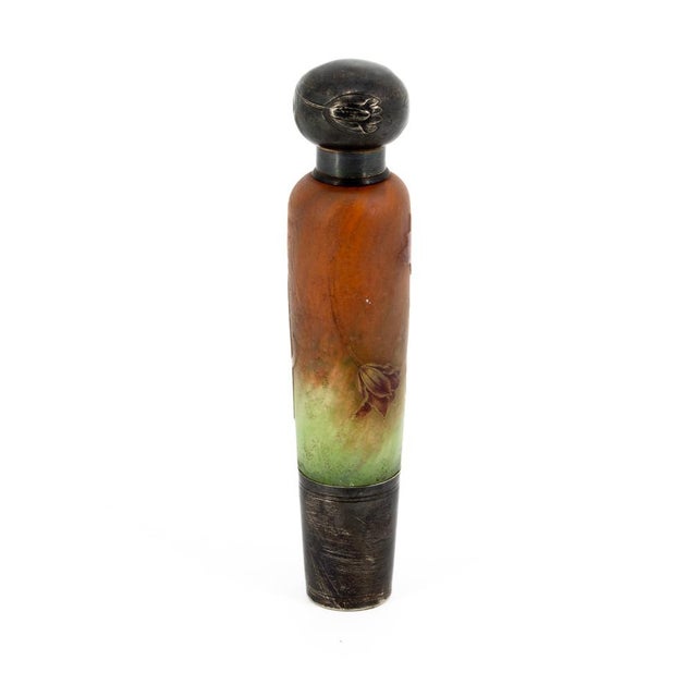 An exclusive cylindrical perfume bottle (or salt holder) in multi-layered glass, a masterpiece from the prestigious Daum...