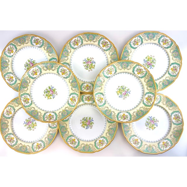 A striking set of eight hand-painted porcelain dinner plates by Meito China, Japan, dating to the 1930s and embodying...