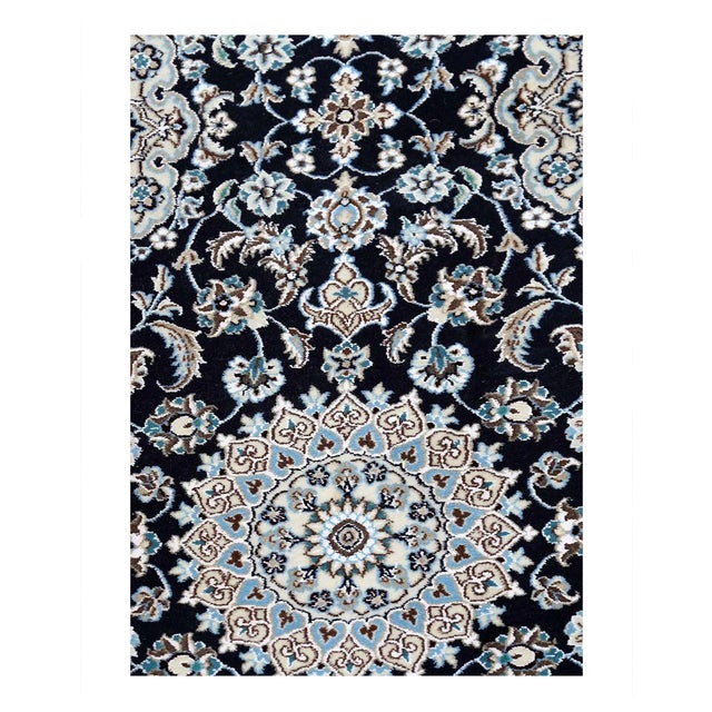 Beautiful hand-knotted Nain rug made from wool and silk. Nain is a small village located in central Persia that has...
