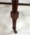 This is a mid-century vintage pair of regency style cane and walnut benches. This pair of benches have a hand woven cane...