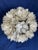 Beautiful statement piece featuring layered lotus flower blossoms handcrafted from natural capiz shell. Approximately 18"...