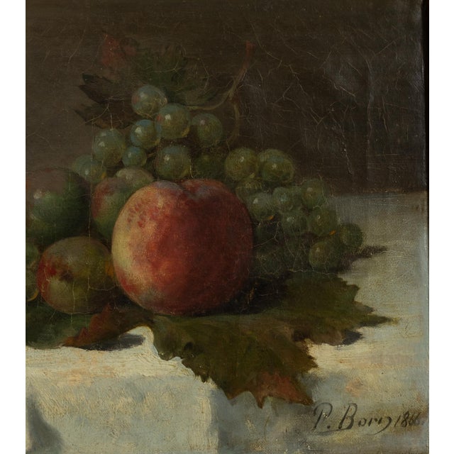 A 19th Century still life oil on canvas with a gilt frame. A 1866 dated representation of fruits (apples and grapes)...