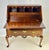 Queen Anne style mahogany slant-front bureau secretary desk on stand. This beautifully crafted two-part piece features a...