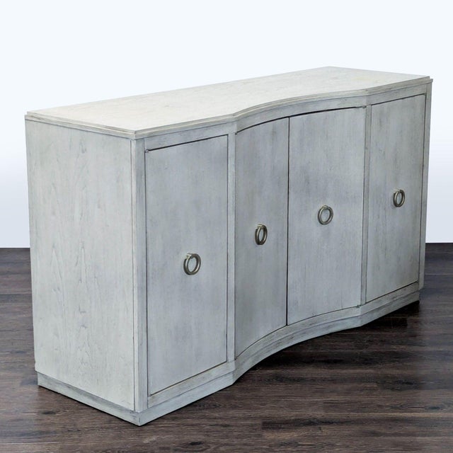 The credenza features four doors – left side facing with two reversible/adjustable wine bottle shelves, right side facing...