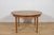Extendable table was manufactured in the 1960s in Great Britain. Dining Table with a round shape, the table has reinforced...