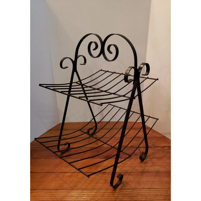 Vintage 2 Tier Black Metal Magazine Rack with scroll design. Great condition with nothing bent or broken. 20 inches tall...