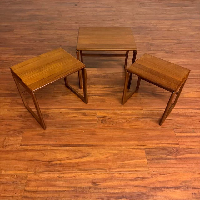 Set of three Danish modern, solid teak nesting tables circa 1970's featuring beautiful teak grain, nicely rounded edges...