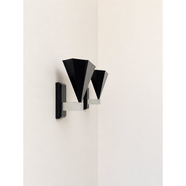 Pair of metal wall sconces produced in Italy in the 1980s. Timeless postmodern geometric design, excellent craftsmanship,...