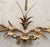 Hollywood Regency style brass wall sconce, specifically an Italian-designed 5-armed candelabra wall sconce. Crafted from...