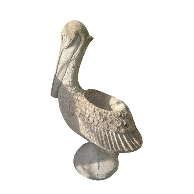 This charming vintage garden planter is masterfully crafted from heavy cast stone, depicting a stately pelican in a seated...