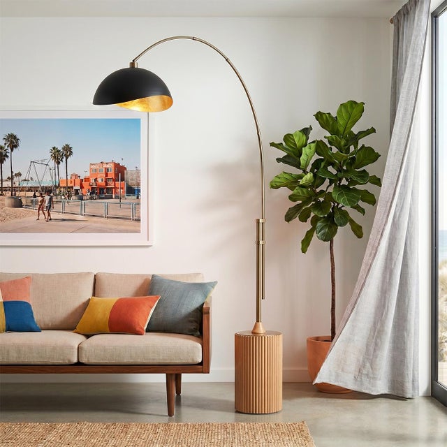 The Tambo Arc Lamp is a dimmable mid-century modern lighting piece designed by Peter Morelli in 1984. This elegant arc...