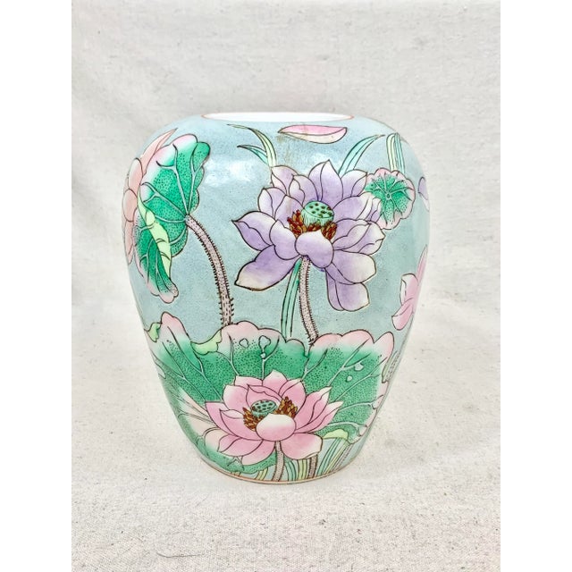 Beautiful vintage vase. Pastel colors. Features waterlily/lotus flowers. Great to hold flowers or as a decorative accent....