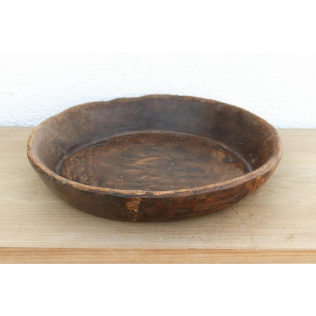 There is a soulful weight to this old wooden bowl that only comes with age. Originally hand-carved and likely used in a...