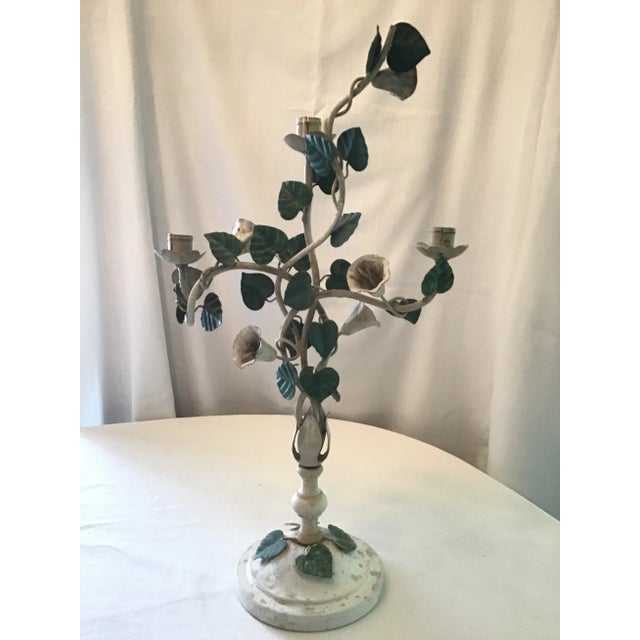 This charming rustic three candle Italian tole candelabra is a much loved vintage piece, twined with green vines and white...