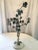 This charming rustic three candle Italian tole candelabra is a much loved vintage piece, twined with green vines and white...