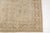 This is a vintage Turkish Oushak rug from the Mid 20th Century. The piece was hand-knotted.