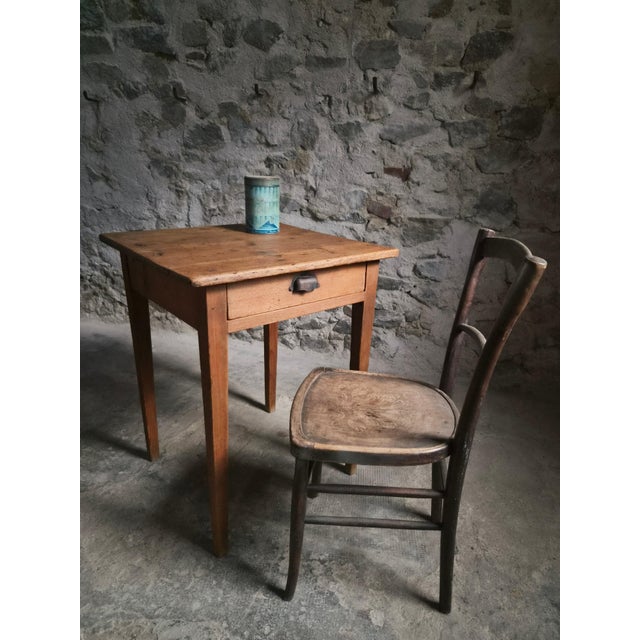 A French pine side table dating from the late 19th century, circa 1870–1900. Made from solid pine, the table has a square...