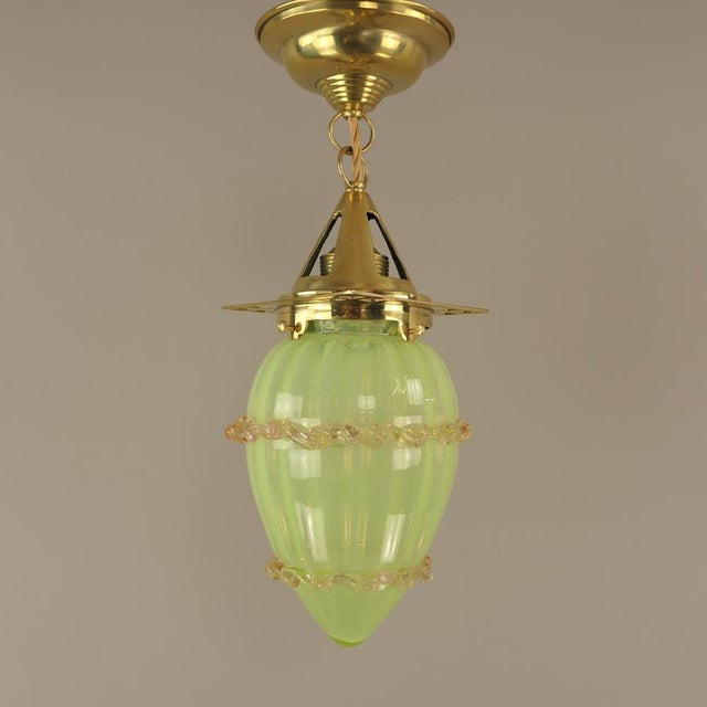 The pendant lamp is made of solid brass and has the typical design features that can be attributed to Josef Hoffmann. The...