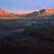 Denali by Raymond Bonilla | Oil on panel Landscape of mountains and valleys at sunset For Sale