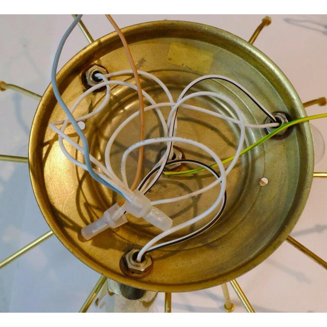 Very beautiful Mid-Century lamp by Palwa from the 70s. The shade consists of a total of 19 flowers made of gilded brass...