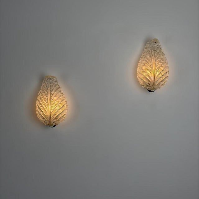 Elegant and sculptural pair of Murano glass wall lights designed by Ercole Barovier for Barovier & Toso in the 1940s. Each...