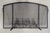 A bold and evocative Western fireplace screen by noted Wyoming craftsman John B. Mortensen, celebrated for his sculptural...