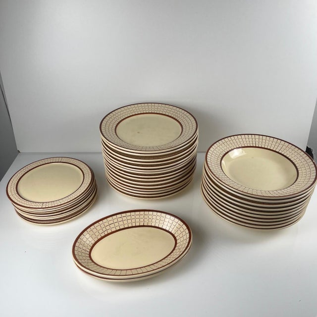 Longchamp "Colmar" pattern dinner service, 1950/1960, comprising: Art Deco style White ceramic In shades of cream, white,...
