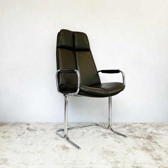 Eleganza cantilever armchair designed by Tim Bates for Pieff, 1970s. Chrome-plated tubular steel frame with dark brown...