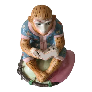 Late 20th Century North Carolina Ceramic Whimsical Sitting Monkey Reading a Book Colorful Figurine