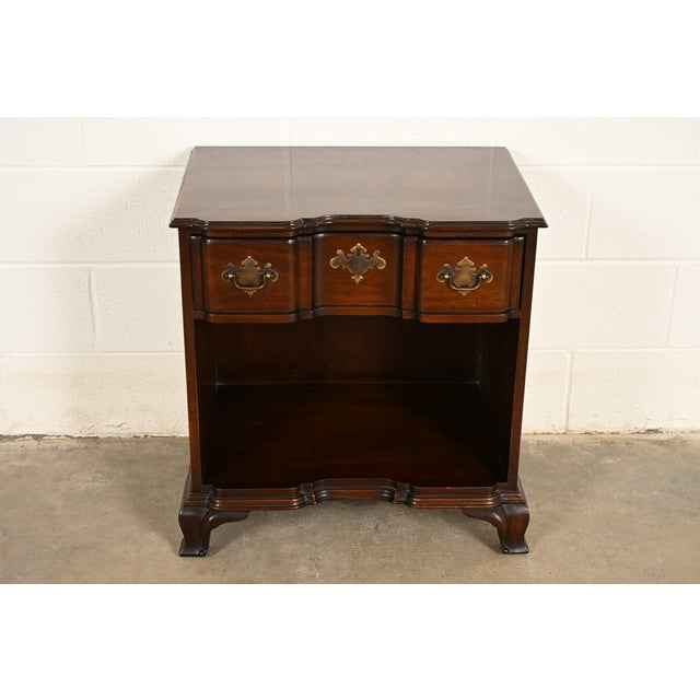 A gorgeous Georgian or Chippendale style block front nightstand or end table By Kindel Furniture USA, Circa 1980s...