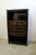 Large Chinese lacquered softwood cabinet, possibly elm, featuring ten drawers with traditional brass ring pulls and...
