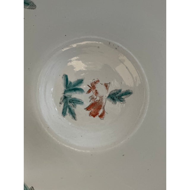 Vintage Koi fish bowl featuring intricate hand‑painted motifs in rich cobalt blue, gold, and warm earth tones, including...