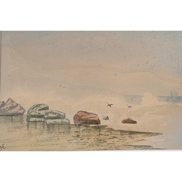 Charming miniature nautical coastal watercolor painting circa 1910 - 1920 depicting a rocky beach shoreline with seagulls...