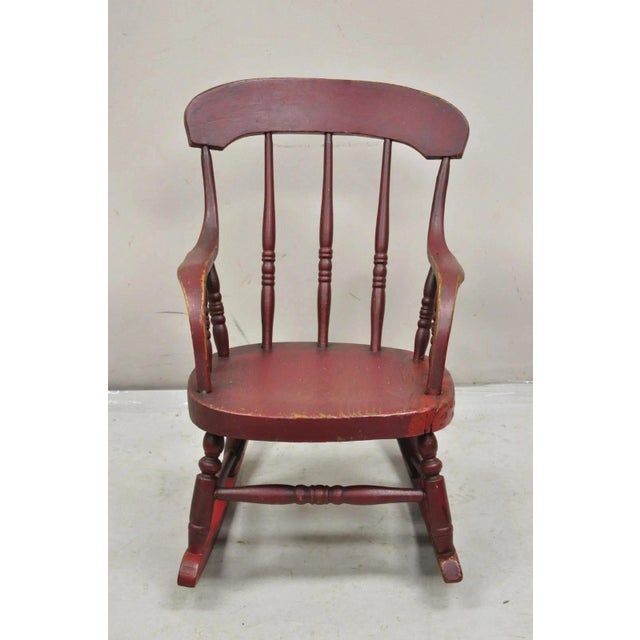 Antique American Primitive Spindle Back Small Child's Rocker Rocking Chair. Circa 19th Century. Measurements: 21" H x 14"...