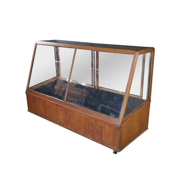 An antique general storage showcase made by the Columbus Showcase Company of Columbus Ohio. Features a large rectangular...