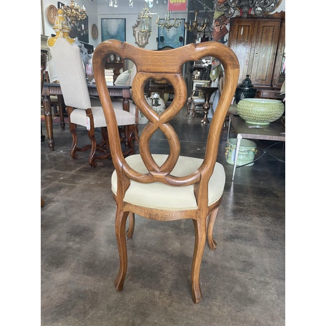 Side Chair With an Antique Walnut Finish. It has elegant hand carved seat and back. Made in Italy. - Classic Elegance for...