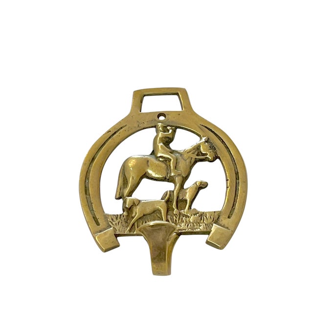 Vintage brass horse and hound wall hook. A horseshoe with rider and two dogs. Hook for hat or coats.