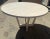 Modern round dining table table. The table is made of solid oak with a white ceruse finish. The table measures 54” in dia...