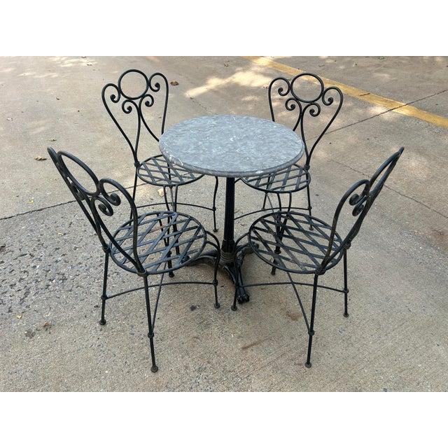 1990s Wrought Iron Decorative Patio Set Stone Top Table and 4 Chairs For Sale - Image 4 of 7