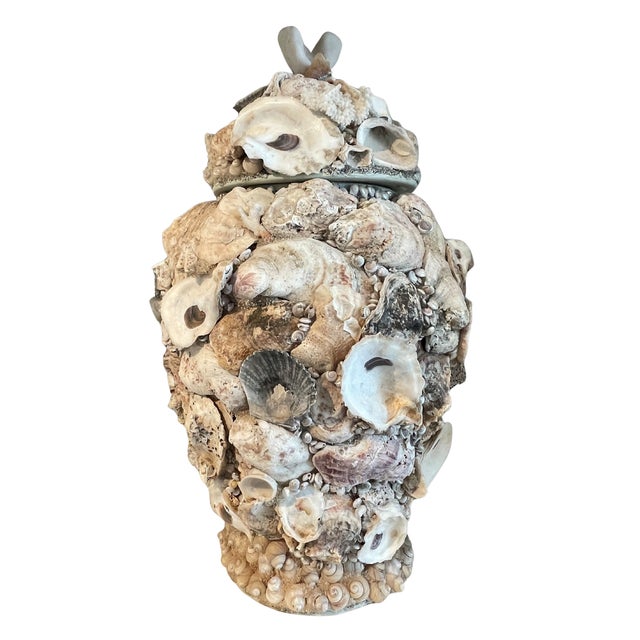 An exceptional pair of large shell-encrusted urns distinguished by their remarkable craftsmanship, scale, and visual...